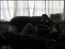 Harry on the laptop checking Greyhound bus departure schedule